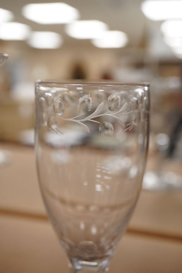 Four Georgian wine glasses, three with engraved bowls, three with faceted stems, and one with an air twist knopped stem and stepped foot, tallest 16cm